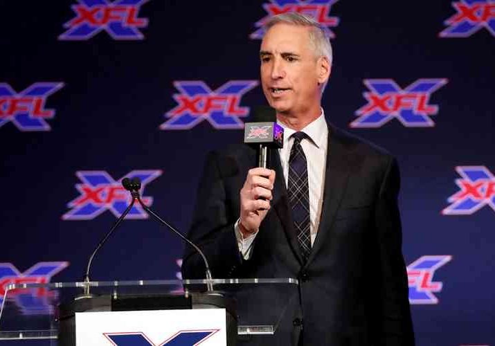 Oliver Luck speaking at an XFL press conference